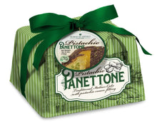 Pistachio panettone cake in green striped wrapper with green bow and branded label