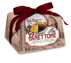Classic panettone cake in beige wrapper with maroon bow and branded label