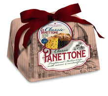 Classic panettone cake in beige wrapper with maroon bow and branded label