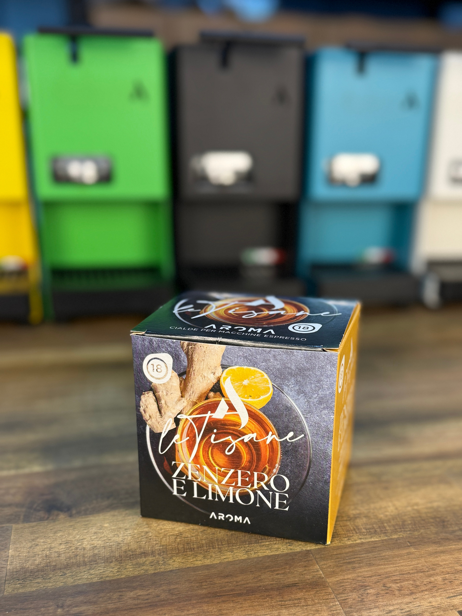 Ginger-lemon herbal tea ESE pods box on wooden tabletop