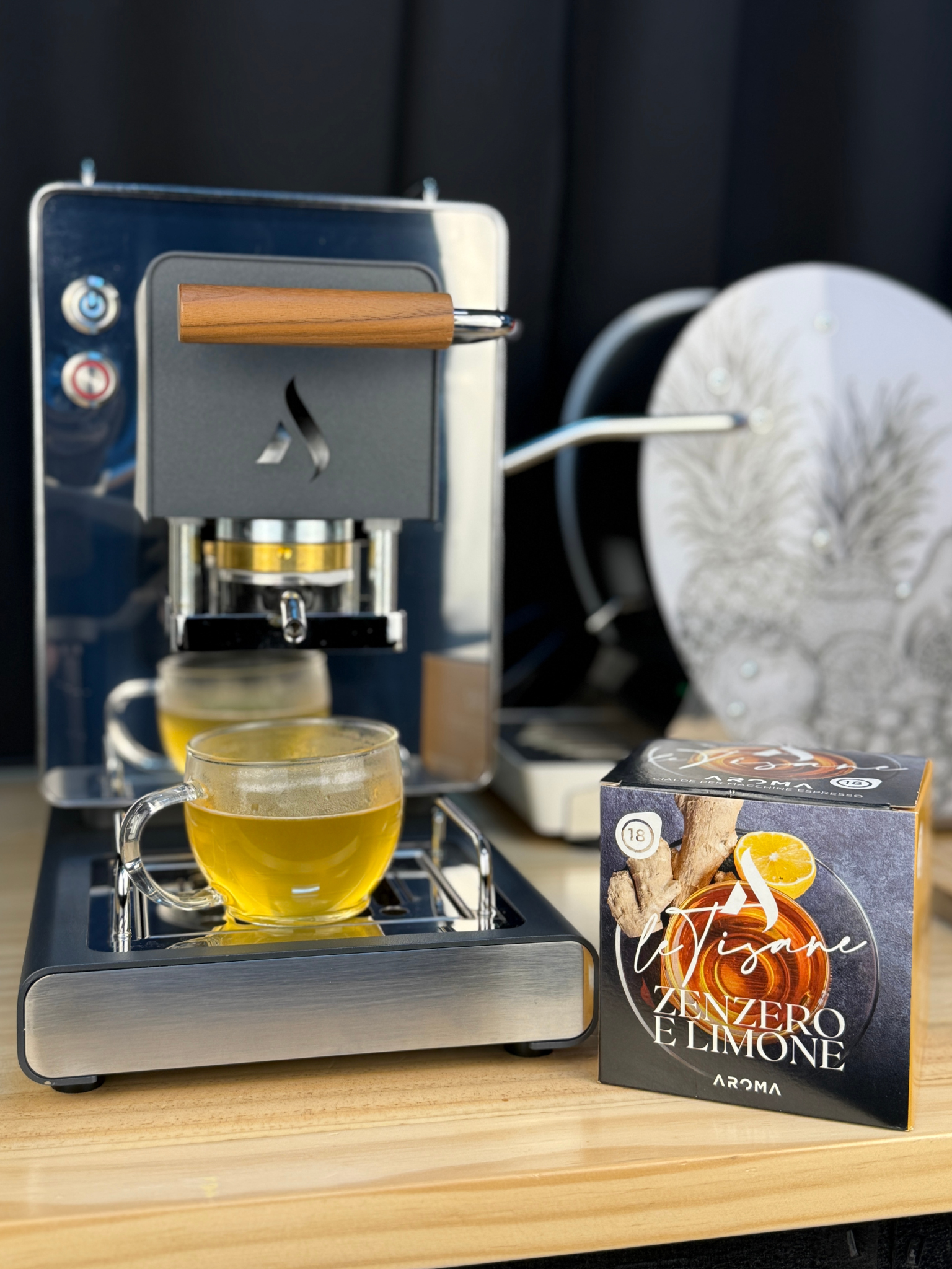 Ginger-lemon herbal tea ESE pods box with cup of brewed tea