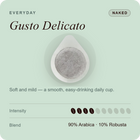 Unwrapped coffee pod for Gusto Delicato, gray coffee filter disc with white base