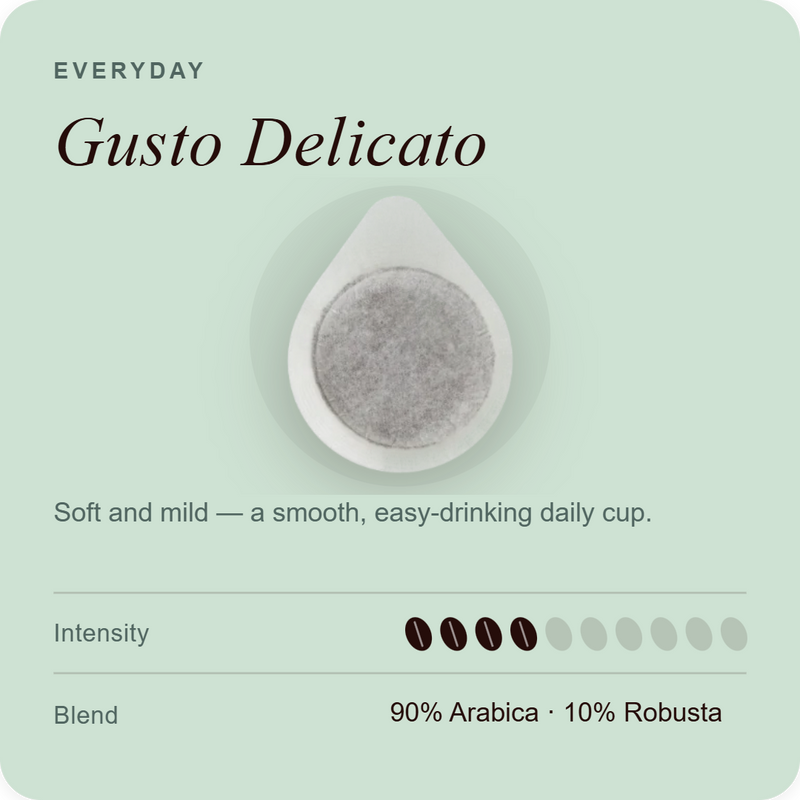 Coffee pod with gray coffee grounds and a white outer capsule