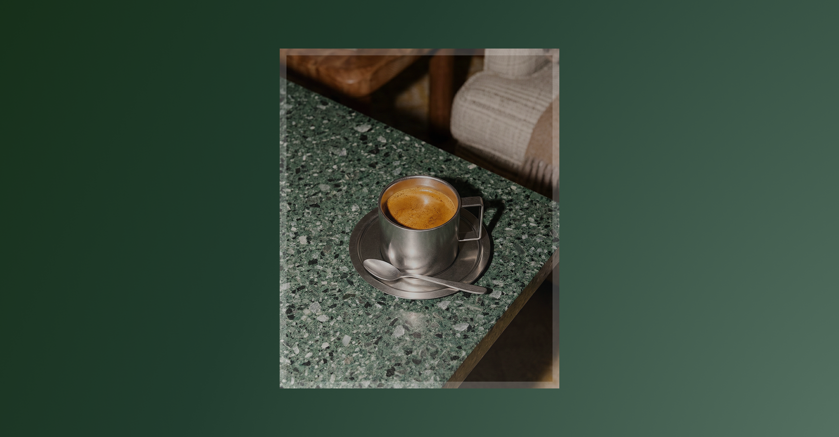Bottega Coffee espresso shot in a metal cup on a green marble surface