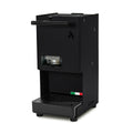 Black coffee pod machine with front pod window and drip tray grate, side spout bar.
