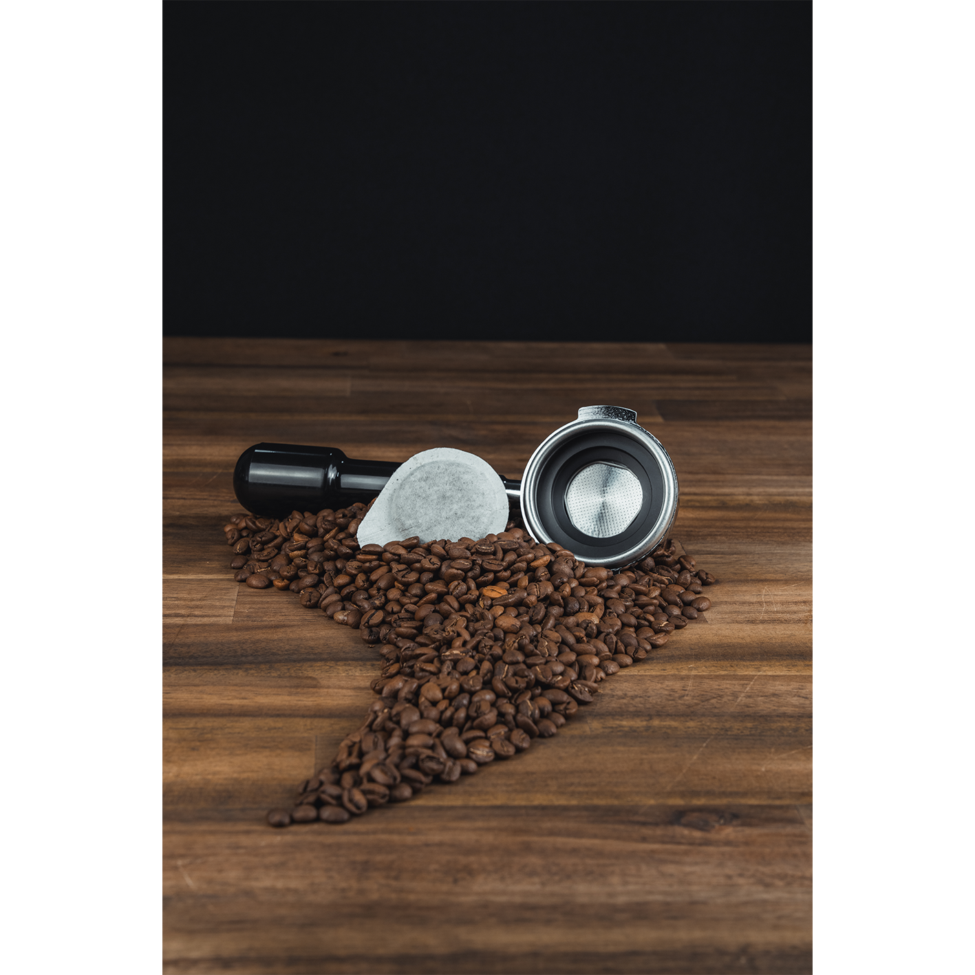 Black and chrome ESE pod handle with stainless pod basket and white coffee pod