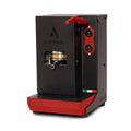 Black coffee pod machine with red top handle and side control panel