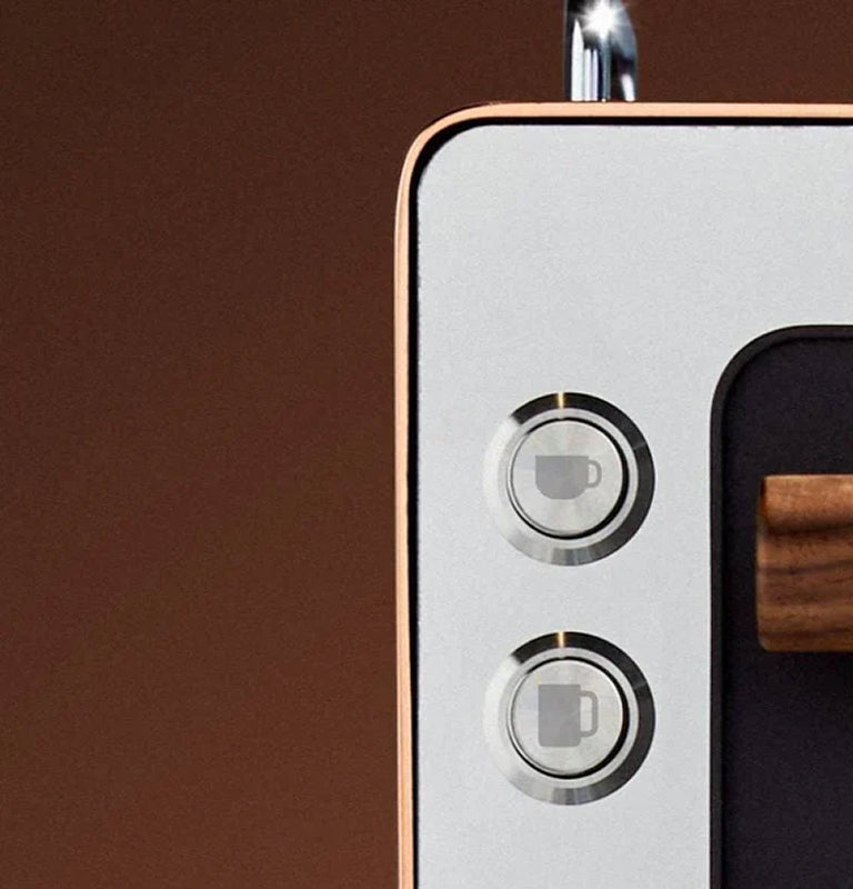 Close-up of a coffee machine with button details on a brown background