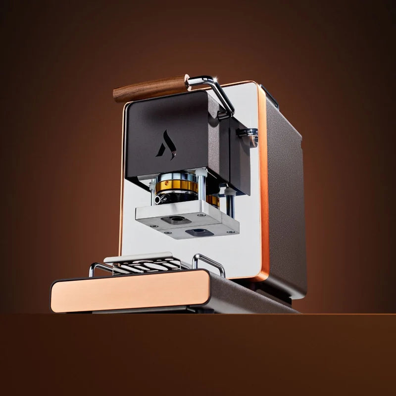 Black ESE coffee pod machine with raised brew head, pod holder, and spout