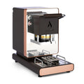 Black ESE coffee pod machine with open brew head and drip tray, rose-gold accents