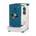 Blue coffee pod machine with silver handle, dark control knobs, and drip tray