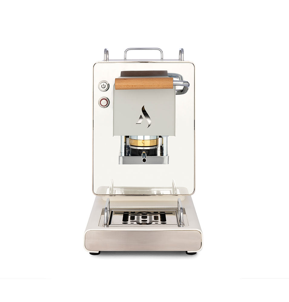 White coffee pod machine with wooden handle, front brew chamber, and drip tray